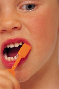 Child brushing teeth